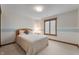 Cozy bedroom featuring a comfortable bed, and a window with wood trim at 2411 N County Road 500 W, Muncie, IN 47304
