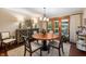 Formal dining room with stylish lighting, copper table, and sliding glass doors at 2411 N County Road 500 W, Muncie, IN 47304