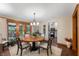 Inviting dining room with wood table, elegant lighting, and access to the backyard at 2411 N County Road 500 W, Muncie, IN 47304