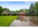 Beautiful ranch home with lush green lawn and mature trees at 2411 N County Road 500 W, Muncie, IN 47304