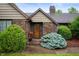 Charming front entrance with brick facade and well-manicured landscaping at 2411 N County Road 500 W, Muncie, IN 47304