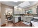 Bright kitchen features ample counter space, wood floors, and a window looking into the yard at 2411 N County Road 500 W, Muncie, IN 47304