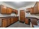 Kitchenette with sink, dark countertops, and wooden cabinetry at 2411 N County Road 500 W, Muncie, IN 47304
