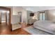 Spacious main bedroom with skylight, wood floors, and adjacent bathroom at 2411 N County Road 500 W, Muncie, IN 47304