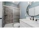Modern bathroom with a walk-in shower, stylish vanity, and elegant fixtures at 2429 N Centennial St, Indianapolis, IN 46222