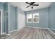 A bright bedroom with laminate floors, double windows, and a spacious closet at 2429 N Centennial St, Indianapolis, IN 46222