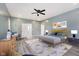 A modern bedroom with stylish furnishings, a ceiling fan, and ample natural light at 2429 N Centennial St, Indianapolis, IN 46222