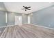A large bedroom with light gray laminate flooring and neutral walls, ready for personalization at 2429 N Centennial St, Indianapolis, IN 46222