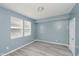 Well-lit bedroom with neutral tones, large windows, and sleek flooring offers a calming retreat at 2429 N Centennial St, Indianapolis, IN 46222