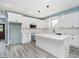 Bright, stylish kitchen with white cabinets, island, and modern lighting at 2429 N Centennial St, Indianapolis, IN 46222