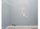 Bright laundry room with light gray walls, wood-look flooring and wire shelving at 2429 N Centennial St, Indianapolis, IN 46222