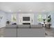Stylish living room features a modern fireplace, built-in shelving, and ample natural light at 2429 N Centennial St, Indianapolis, IN 46222