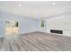 Spacious living room featuring recessed lighting, modern fireplace, and a sliding glass door at 2429 N Centennial St, Indianapolis, IN 46222
