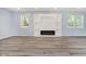Bright living room with recessed lighting features a modern fireplace and built-in shelving at 2429 N Centennial St, Indianapolis, IN 46222