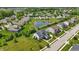Scenic aerial view of a home in a well-planned community with a pond and manicured lawns at 2485 Alexandra Dr, Carmel, IN 46074