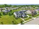 Beautiful aerial showcasing a spacious home, lush greenery, neighborhood, and scenic pond views at 2485 Alexandra Dr, Carmel, IN 46074