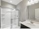 Well-lit bathroom featuring a shower with glass doors and modern fixtures at 2485 Alexandra Dr, Carmel, IN 46074