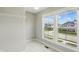 Bedroom features two large windows that provide a view of the neighborhood and a closet with shelving at 2485 Alexandra Dr, Carmel, IN 46074