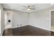 Bedroom featuring dark hardwood floors, a ceiling fan, and doorway access to the Primary bath at 2485 Alexandra Dr, Carmel, IN 46074