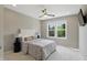 Bright bedroom with a plush bed, accent lamps, and a ceiling fan for added comfort and style at 2485 Alexandra Dr, Carmel, IN 46074