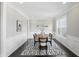Bright dining room with wainscoting, dark wood floors and a statement rug at 2485 Alexandra Dr, Carmel, IN 46074