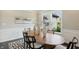 Dining room with light wall paint, dark floors and bright windows at 2485 Alexandra Dr, Carmel, IN 46074