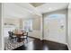 Elegant foyer featuring dark wood floors and arched doorway to dining room at 2485 Alexandra Dr, Carmel, IN 46074