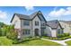 Attractive two-story home with brick and siding, complemented by lush landscaping at 2485 Alexandra Dr, Carmel, IN 46074