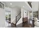 Open foyer with staircase, modern decor, and view into living spaces offers a welcoming entry at 2485 Alexandra Dr, Carmel, IN 46074