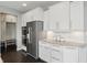 Kitchen area features stainless appliances, granite countertops, white backsplash and cabinets at 2485 Alexandra Dr, Carmel, IN 46074