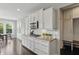 Kitchen features stainless appliances, granite countertops, white backsplash and cabinets at 2485 Alexandra Dr, Carmel, IN 46074