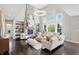 Expansive living room boasting a stone fireplace, tall ceilings, and comfortable seating arrangement at 2485 Alexandra Dr, Carmel, IN 46074