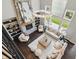 Open living room featuring high ceilings, stone fireplace, and large windows offering plenty of natural light at 2485 Alexandra Dr, Carmel, IN 46074