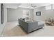 Cozy living room with a modern sofa, ceiling fan, and bright window at 2485 Alexandra Dr, Carmel, IN 46074