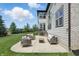 Inviting patio featuring stylish outdoor seating, a coffee table, and lush green lawn in the background at 2485 Alexandra Dr, Carmel, IN 46074
