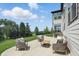Cozy patio area with comfortable seating, a wooden coffee table, and views of the lush green yard at 2485 Alexandra Dr, Carmel, IN 46074