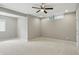 Open and airy room with neutral colors, a ceiling fan, and a bright window at 2485 Alexandra Dr, Carmel, IN 46074