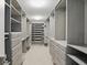 A spacious walk-in closet with built-in shelving and drawers, providing ample storage space at 2485 Alexandra Dr, Carmel, IN 46074