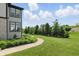 Expansive backyard featuring lush green grass, mature trees, and well-maintained landscaping at 2485 Alexandra Dr, Carmel, IN 46074