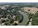 Aerial view of home nestled among lush greenery and scenic river at 258 Riverwood Dr, Noblesville, IN 46062