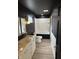 Bathroom with white tiled tub, double sink vanity and brass fixtures at 258 Riverwood Dr, Noblesville, IN 46062