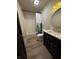 Well-lit bathroom featuring a vanity with gold fixtures, and a shower with a nature-themed curtain at 258 Riverwood Dr, Noblesville, IN 46062