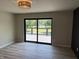 Bedroom featuring modern decor, a view to the balcony, and vinyl plank floors at 258 Riverwood Dr, Noblesville, IN 46062