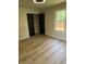 An empty bedroom featuring neutral paint, white trim, black doors, and a window at 258 Riverwood Dr, Noblesville, IN 46062
