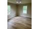 Bright bedroom with new vinyl floors and neutral paint at 258 Riverwood Dr, Noblesville, IN 46062
