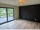 Bedroom with sliding glass doors to a deck overlooking the lake at 258 Riverwood Dr, Noblesville, IN 46062