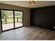 Bedroom featuring modern decor, a view to the balcony, and vinyl plank floors at 258 Riverwood Dr, Noblesville, IN 46062