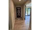A bright, modern home entryway featuring tile floors, neutral walls and a large glass door at 258 Riverwood Dr, Noblesville, IN 46062