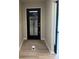 Entryway with black door with glass window and view to a deck at 258 Riverwood Dr, Noblesville, IN 46062