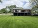 Charming home with a black foundation, and wooden deck overlooking a lush green yard at 258 Riverwood Dr, Noblesville, IN 46062